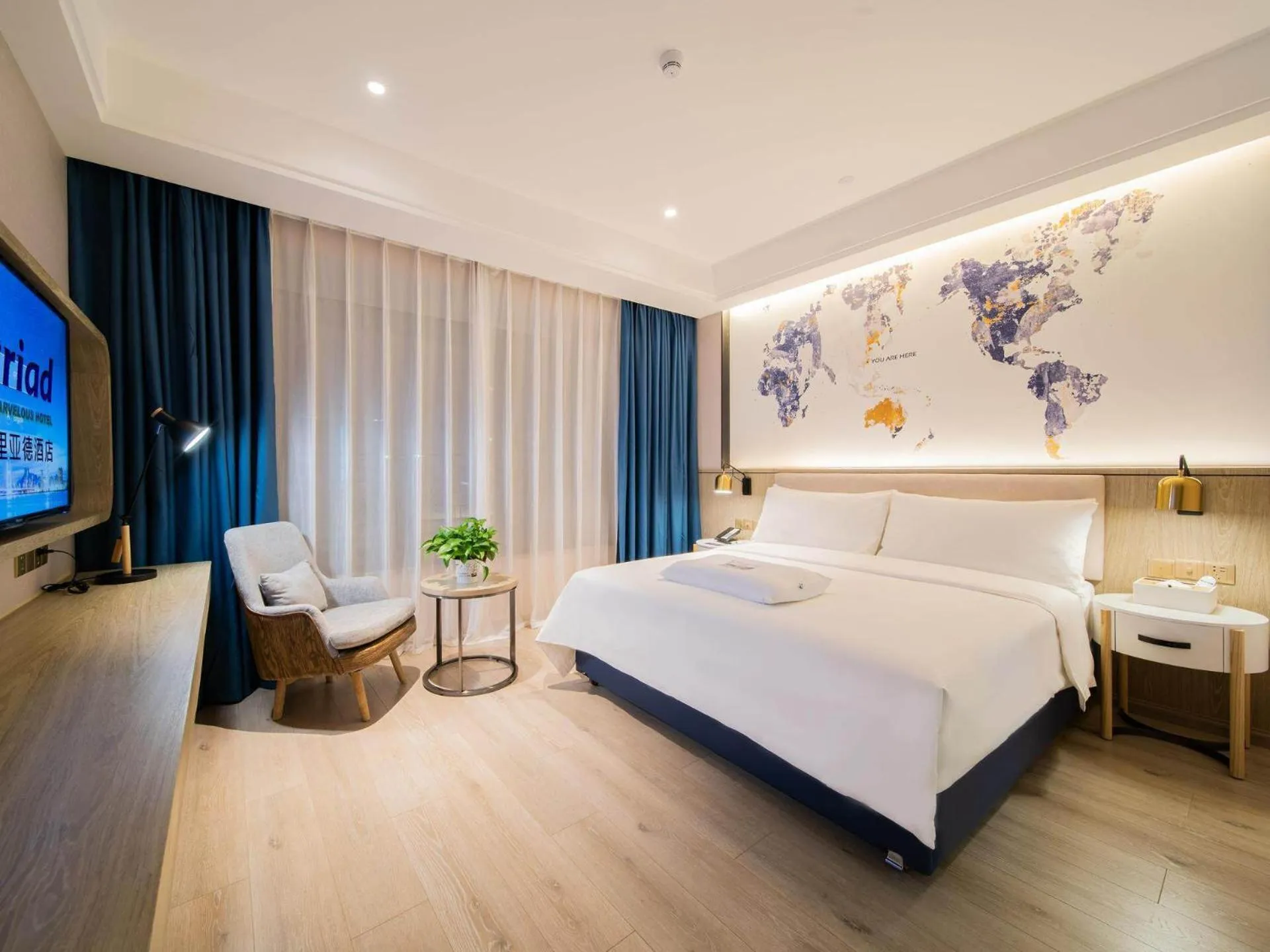 Bed in Kyriad Marvelous Hotel Heyuan Hakka Culture Park