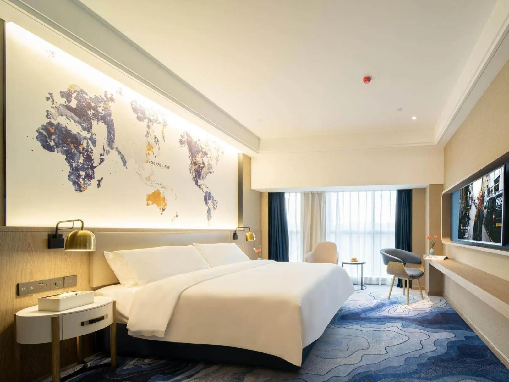 Bed in Kyriad Marvelous Hotel Heyuan Zijin Wanhui Plaza