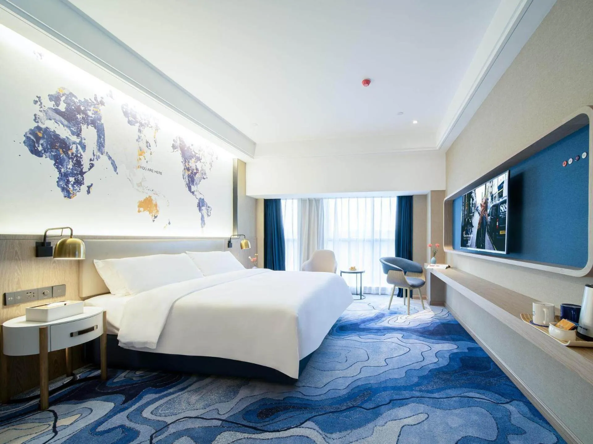 Bed in Kyriad Marvelous Hotel Heyuan Zijin Wanhui Plaza