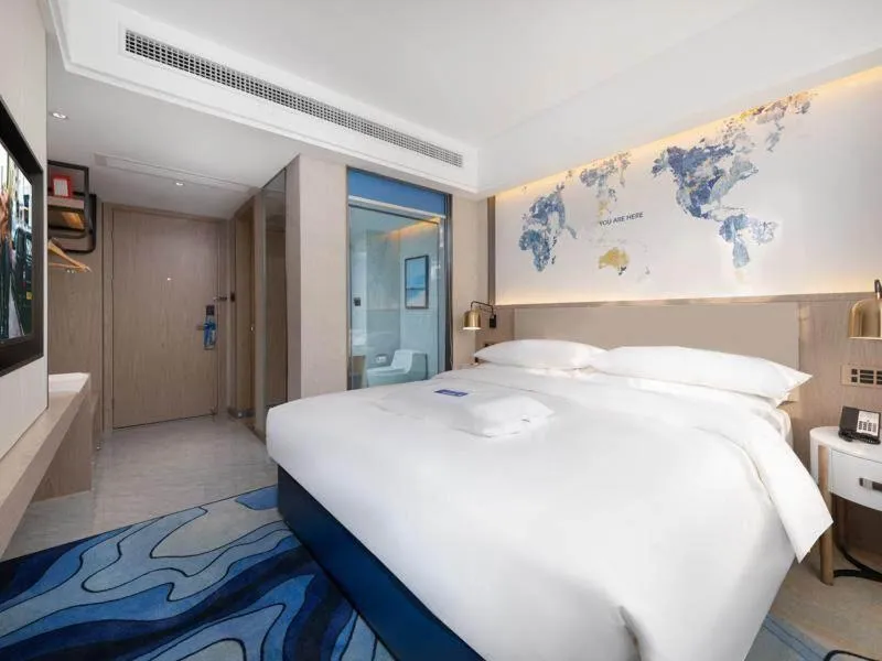 Bed in Kyriad Marvelous Hotel Heyuan Longchuan