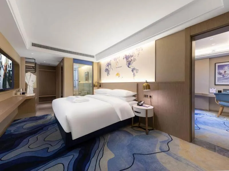 Bed in Kyriad Marvelous Hotel Heyuan Longchuan