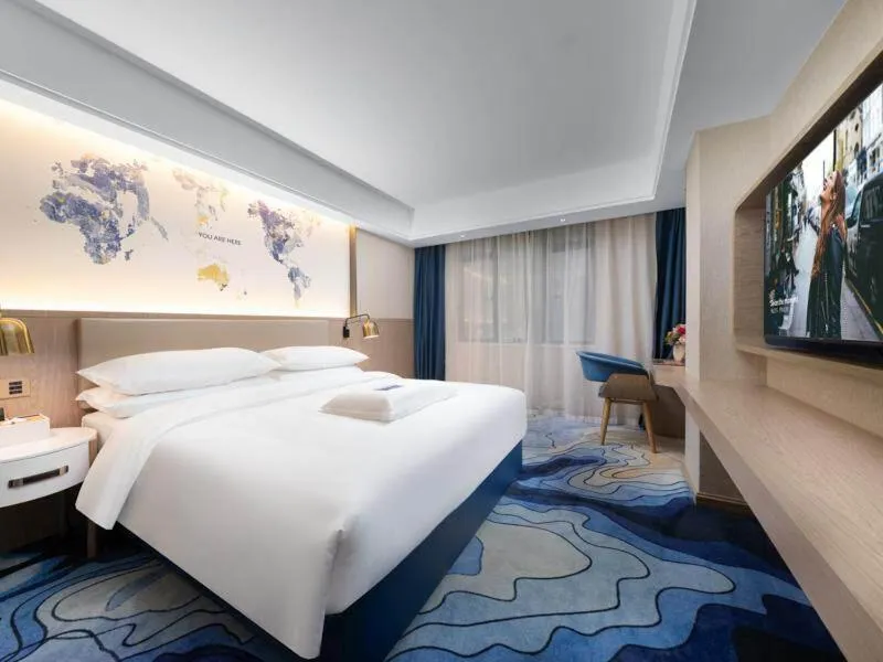 Bed in Kyriad Marvelous Hotel Heyuan Longchuan