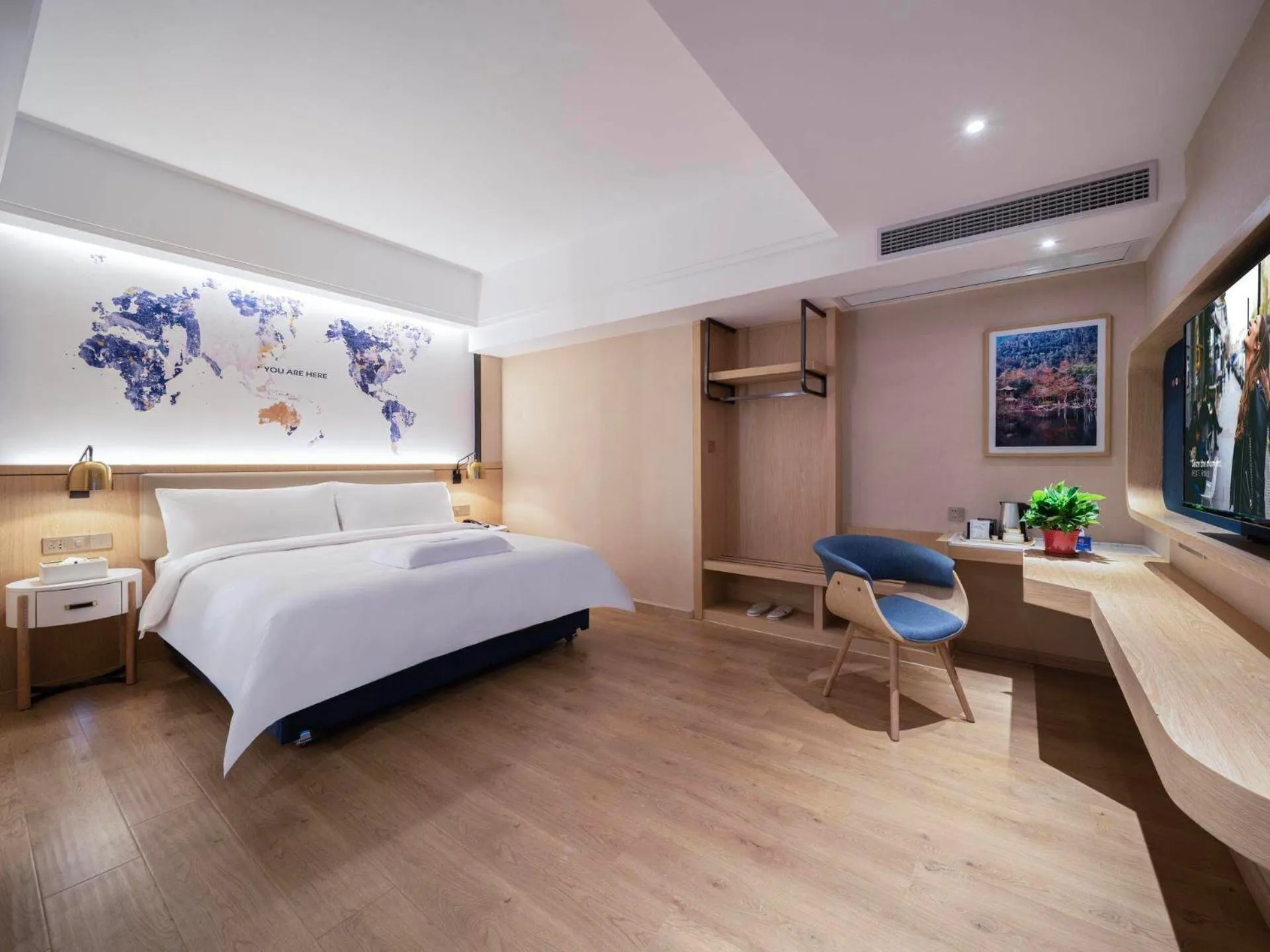 Bed in Kyriad Marvelous Hotel Heyuan Wanda Plaza