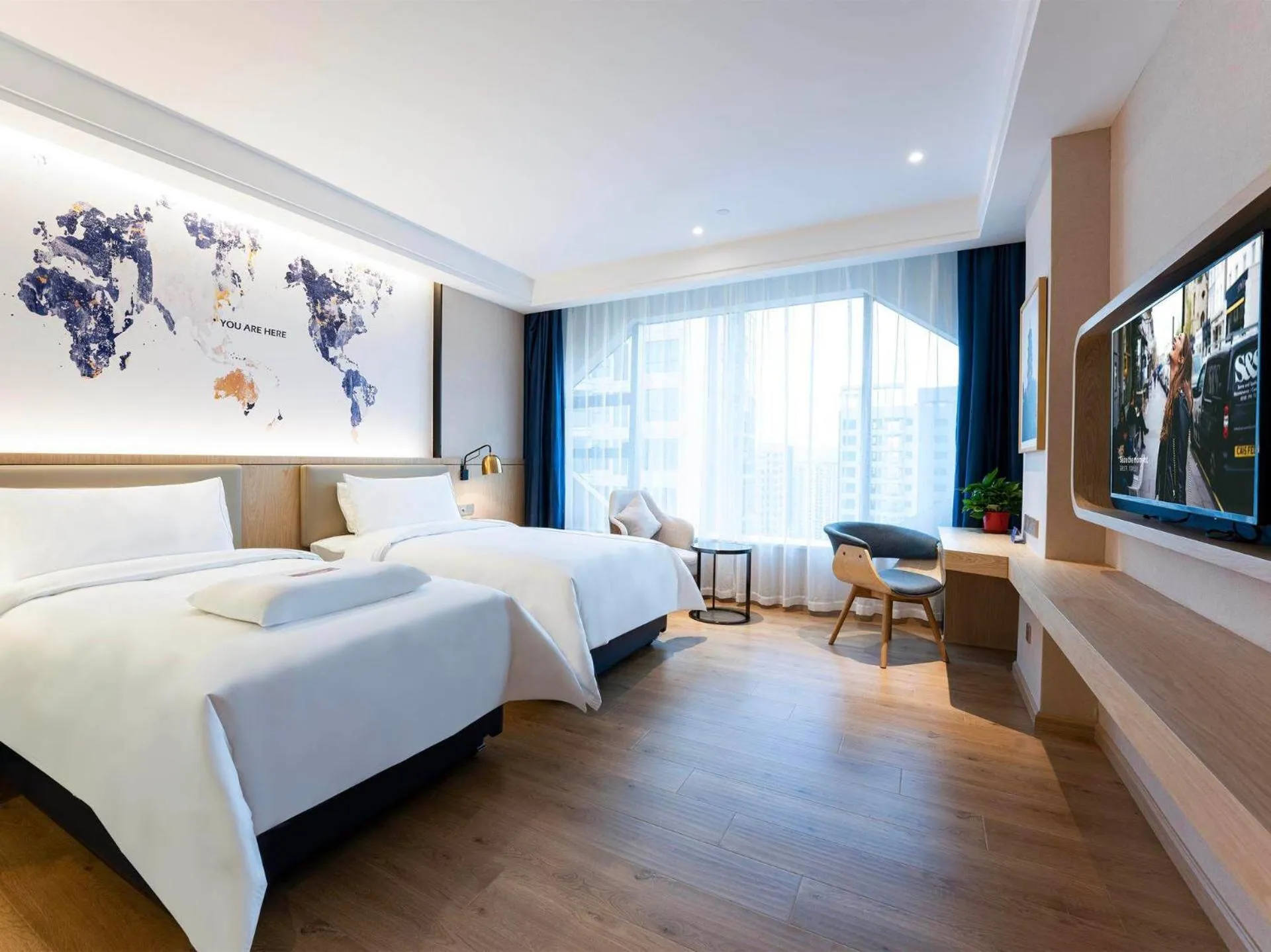 Bed in Kyriad Marvelous Hotel Heyuan Wanda Plaza