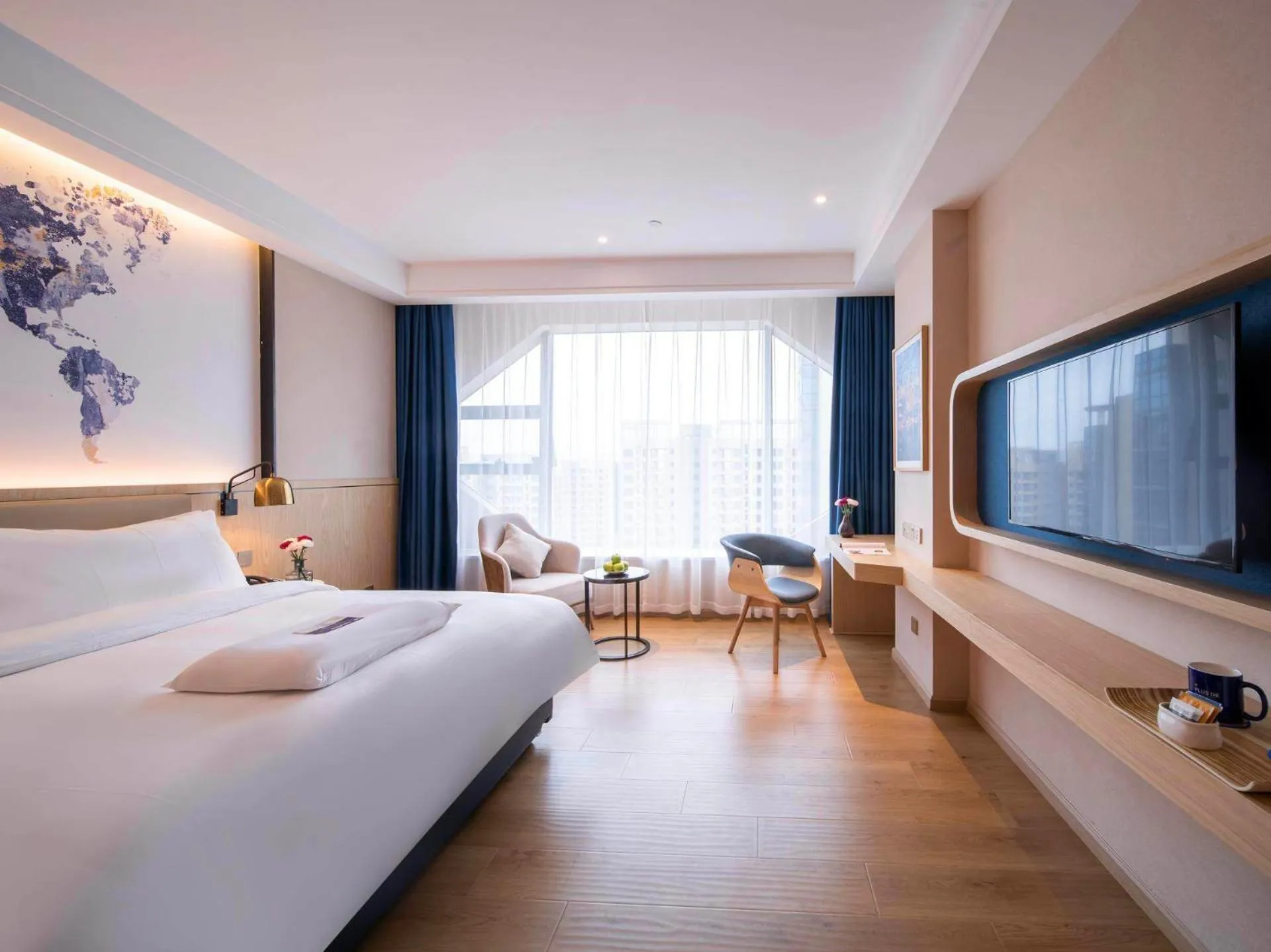 Bed in Kyriad Marvelous Hotel Heyuan Wanda Plaza