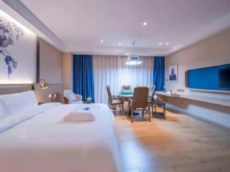 Bed in Kyriad Marvelous Hotel Heyuan Wanda Plaza