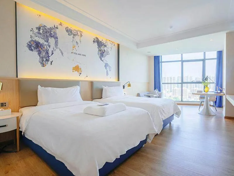 Bed in Kyriad Marvelous Hotel Heyuan Wanlong City