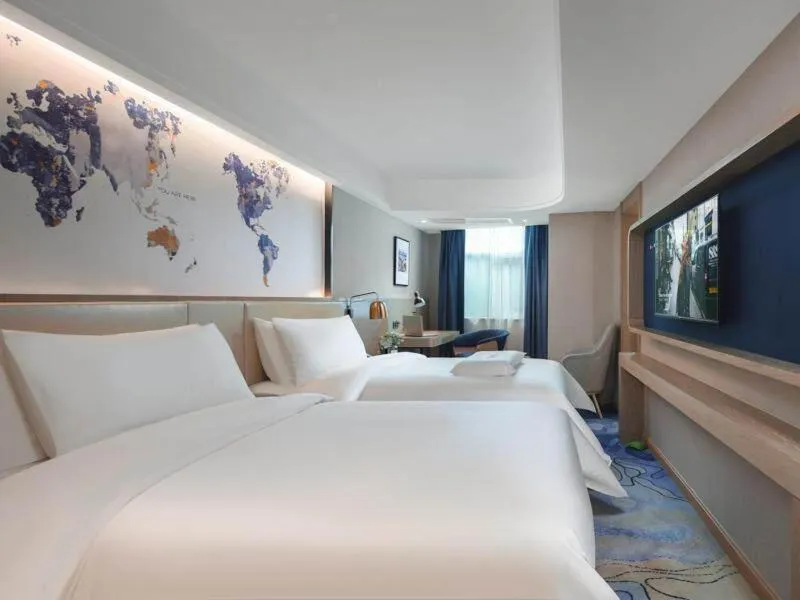 Bed in Kyriad Marvelous Hotel Shenzhen Guangming Zhenmei Subway Station