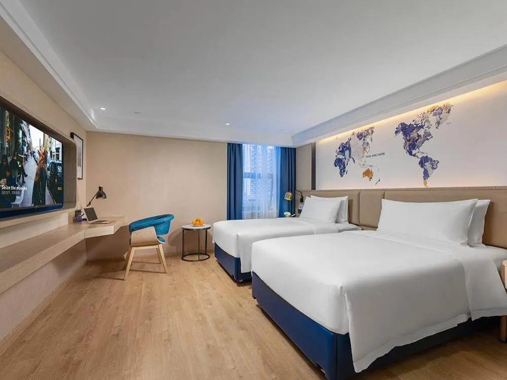 Bed in Kyriad Marvelous Hotel Shenzhen Nanlian Metro Station