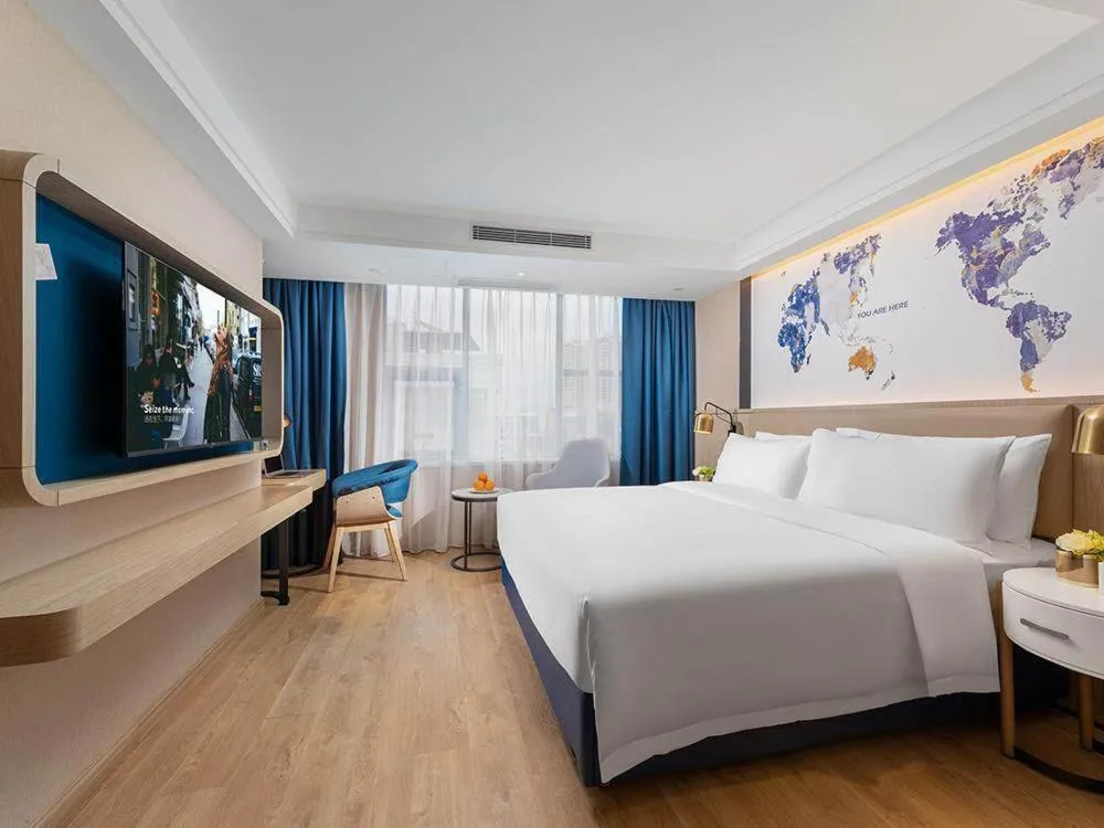 Bed in Kyriad Marvelous Hotel Shenzhen Nanlian Metro Station