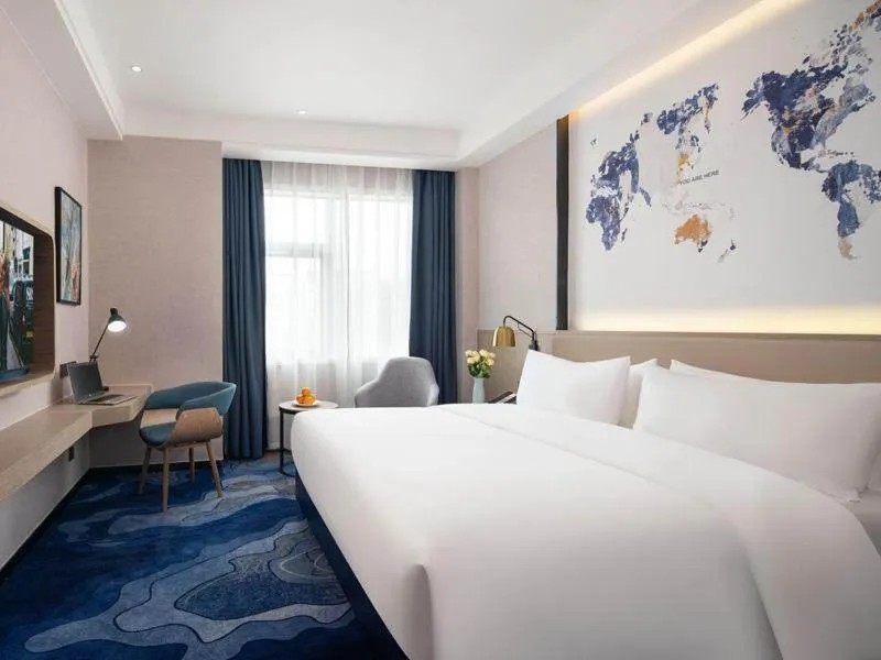 Bed in Kyriad Marvelous Hotel Shenzhen Baoan Gushu Metro Station