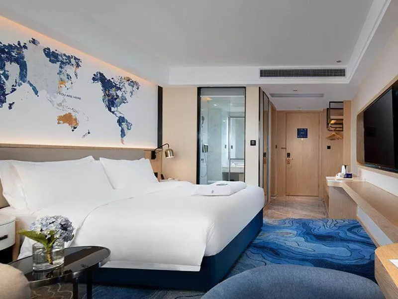 Bed in Kyriad Marvelous Hotel Maoming Dianbai Wanda Plaza