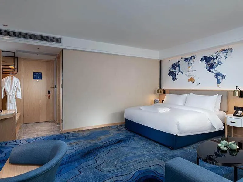 Bed in Kyriad Marvelous Hotel Maoming Dianbai Wanda Plaza