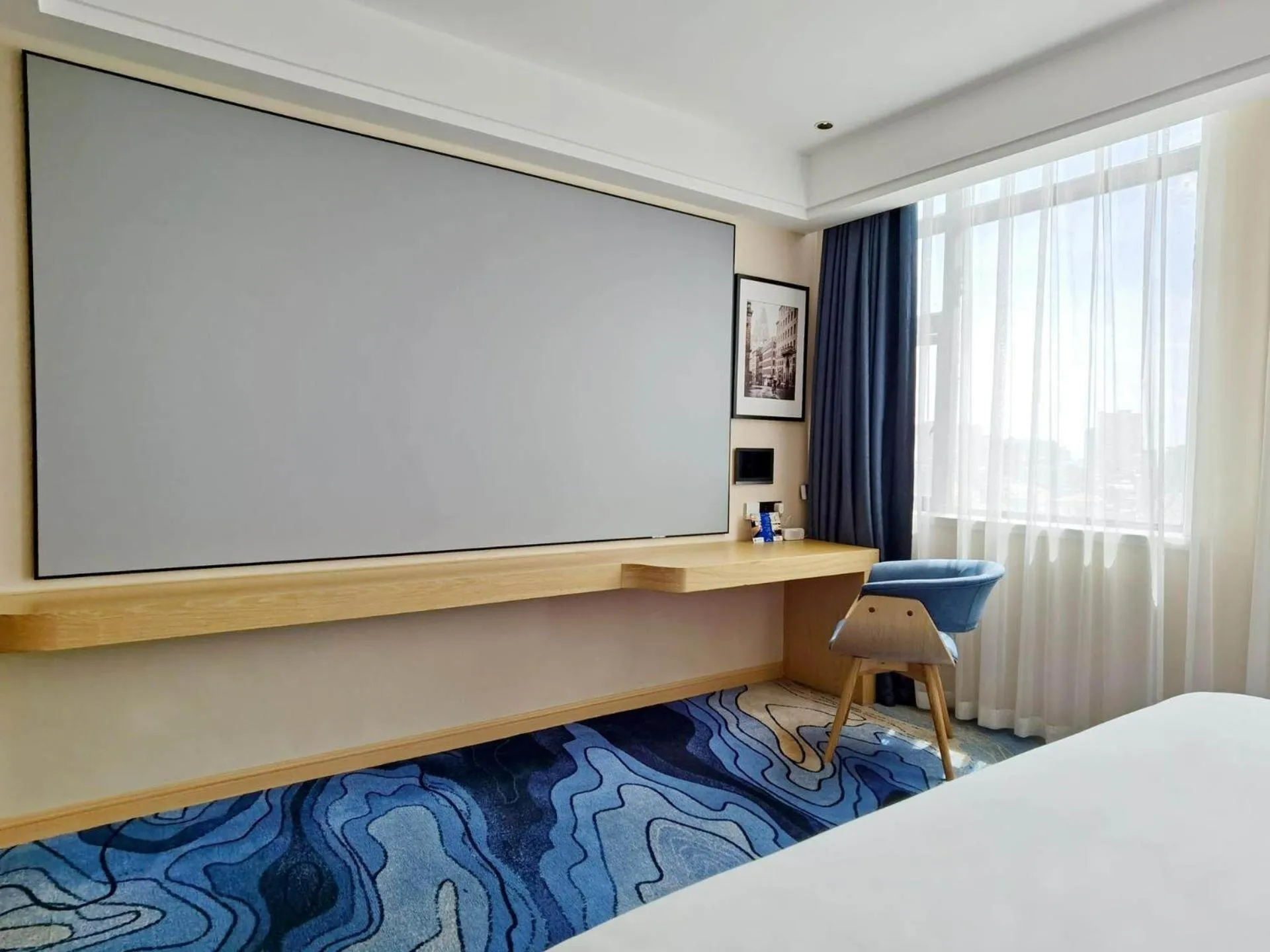 Bed in Kyriad Marvelous Hotel Maoming Dianbai Wanda Plaza