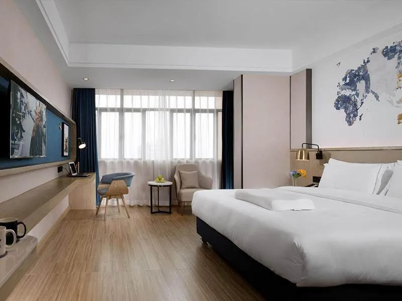Bed in Kyriad Marvelous Hotel Foshan Nanzhuang Taobo Avenue