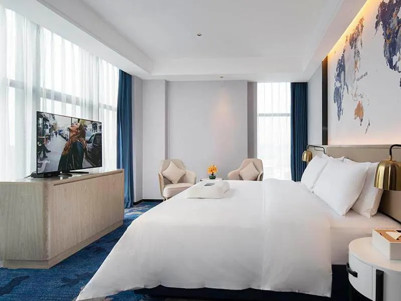 Bed in Kyriad Marvelous Hotel Fangchenggang Administration Center High-Speed Railway Station