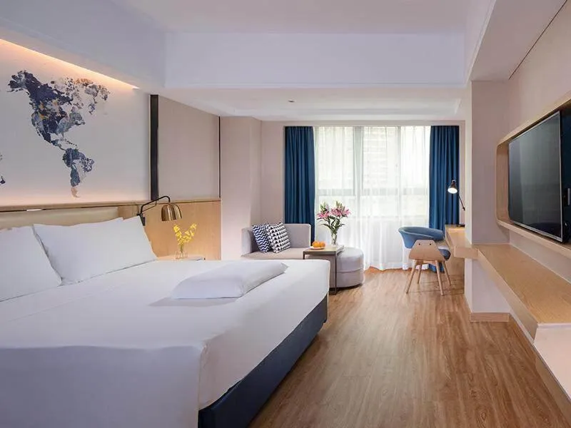 Bed in Kyriad Marvelous Hotel Haikou Free Trade Zone
