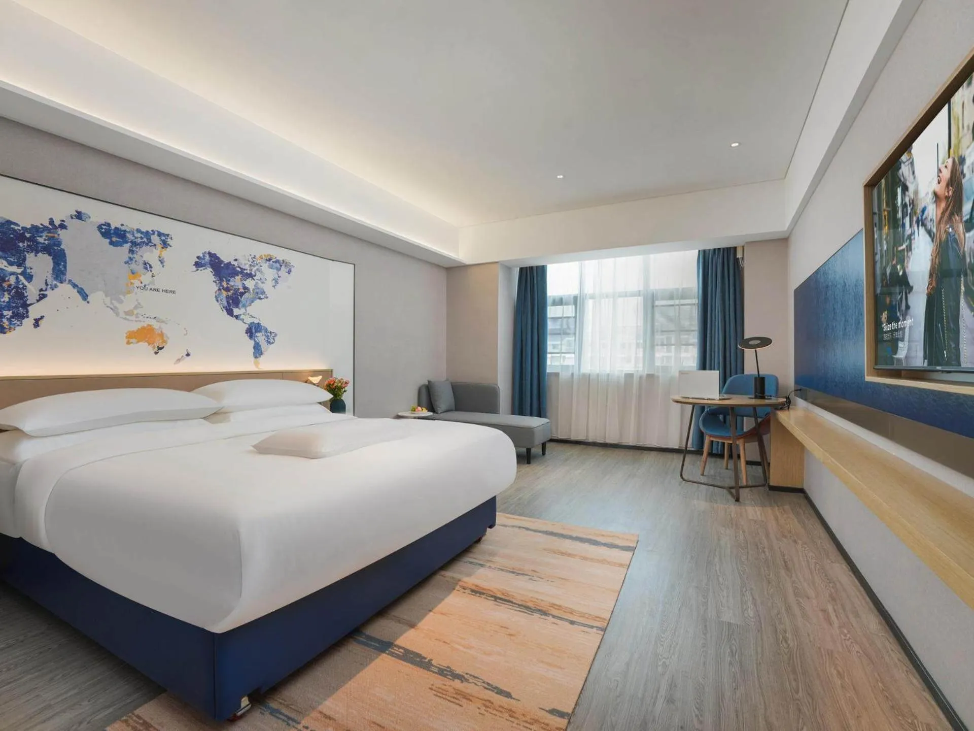 Bed in Kyriad Hotel Baoying Jinyuan Square High-speed Railway Station