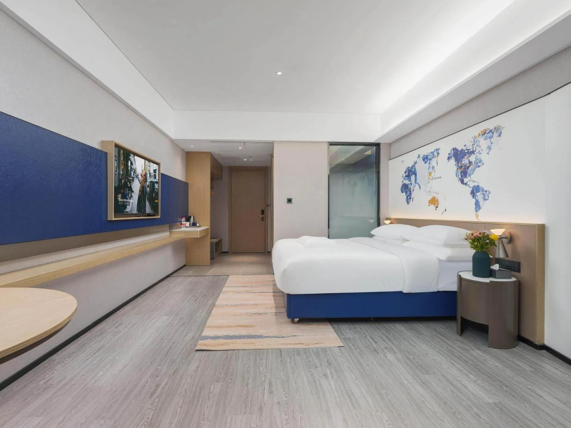 Bed in Kyriad Hotel Baoying Jinyuan Square High-speed Railway Station