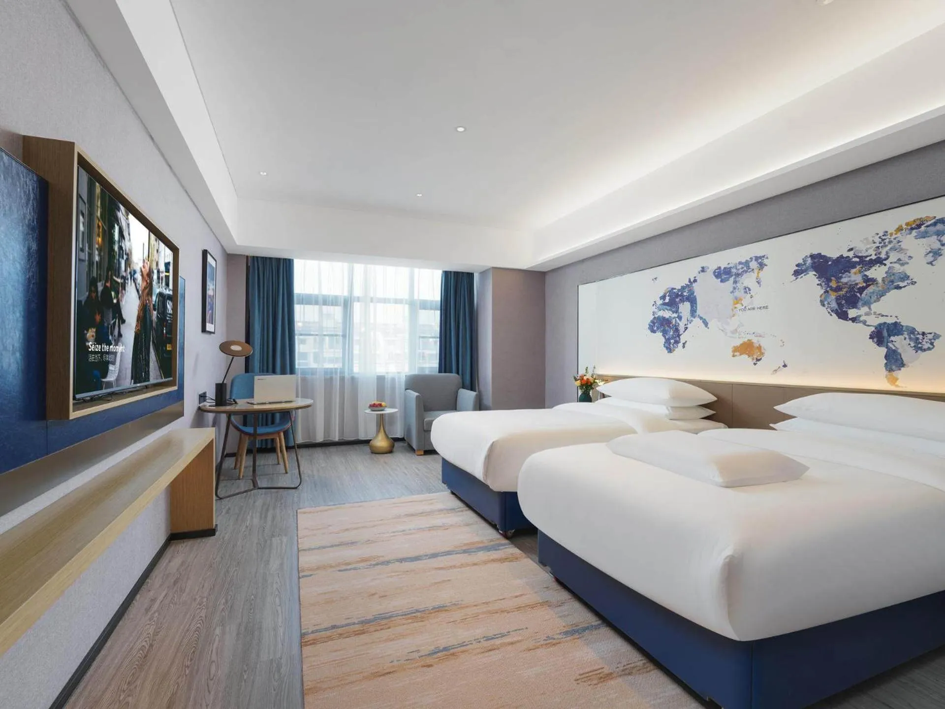 Bed in Kyriad Hotel Baoying Jinyuan Square High-speed Railway Station