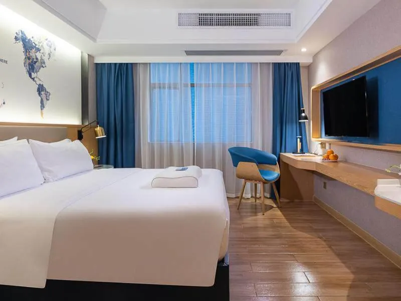 Bed in Kyriad Marvelous Hotel Dongguan Changan Light Rail Station