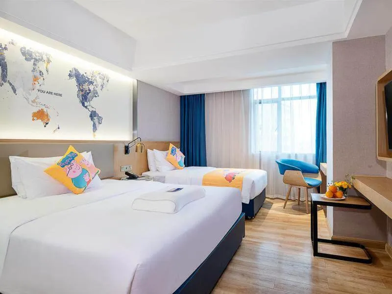 Bed in Kyriad Marvelous Hotel Dongguan Changan Light Rail Station