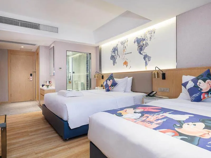 Bed in Kyriad Marvelous Hotel Dongguan Changan Light Rail Station