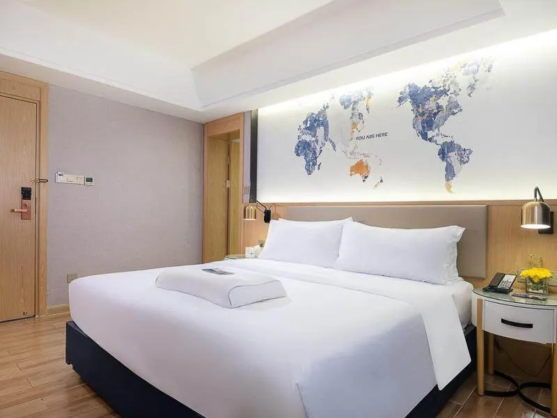 Bed in Kyriad Marvelous Hotel Dongguan Changan Light Rail Station