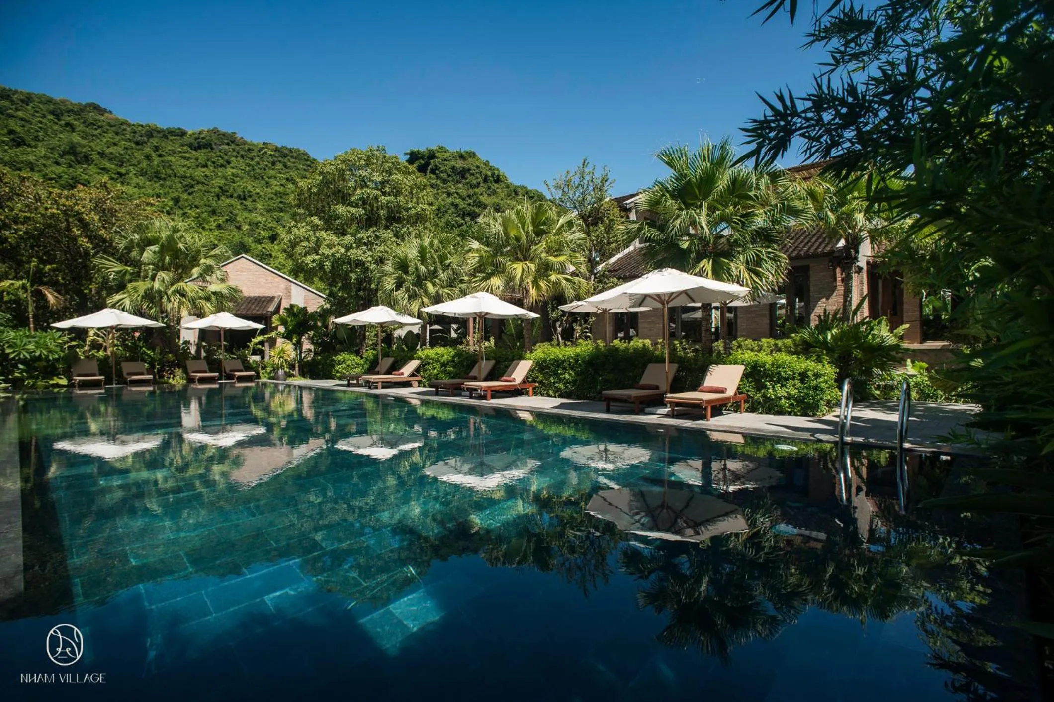 Swimming pool in Nham Village Resort