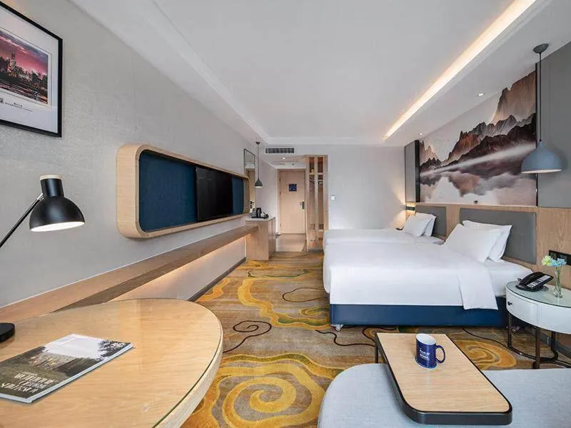 Bed in Kyriad Marvelous Hotel Shenzhen North Railway Station Yousong