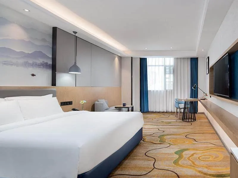 Bed in Kyriad Marvelous Hotel Shenzhen North Railway Station Yousong