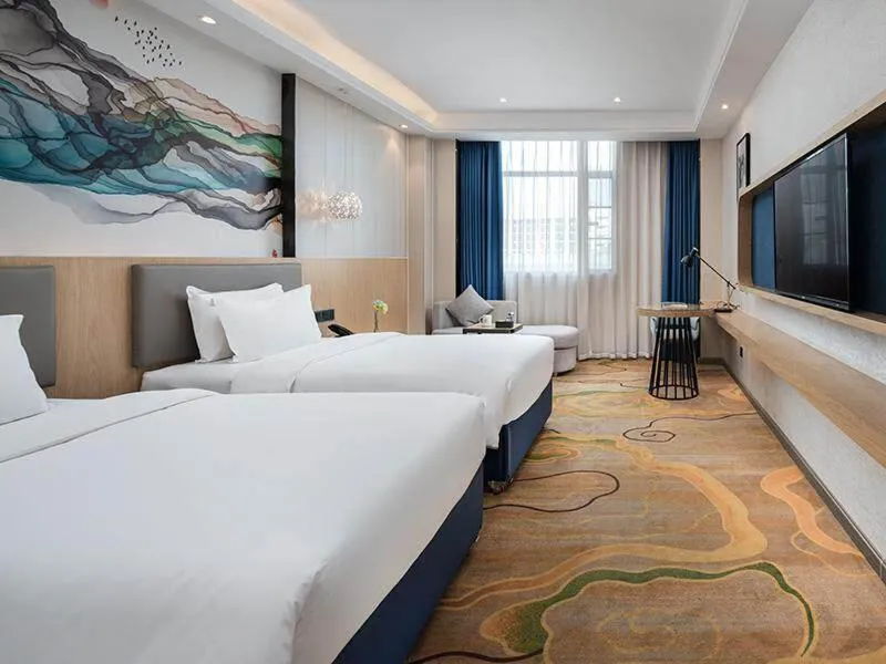 Bed in Kyriad Marvelous Hotel Shenzhen North Railway Station Yousong