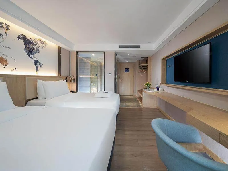 Bed in Kyriad Marvelous Hotel Shenzhen Longhua Dalang Business Center