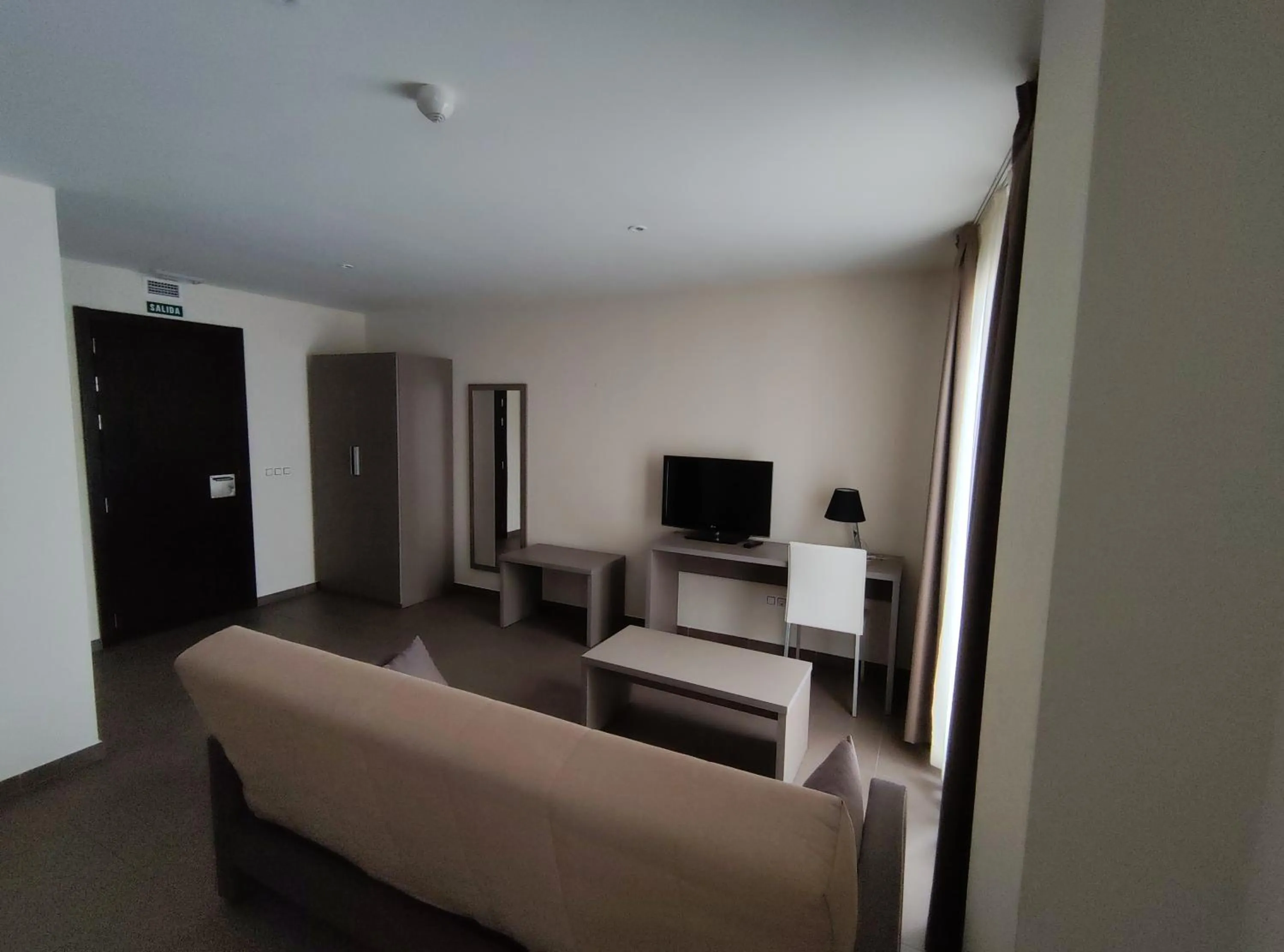 Communal lounge/ TV room in Aparthotel Castellfort