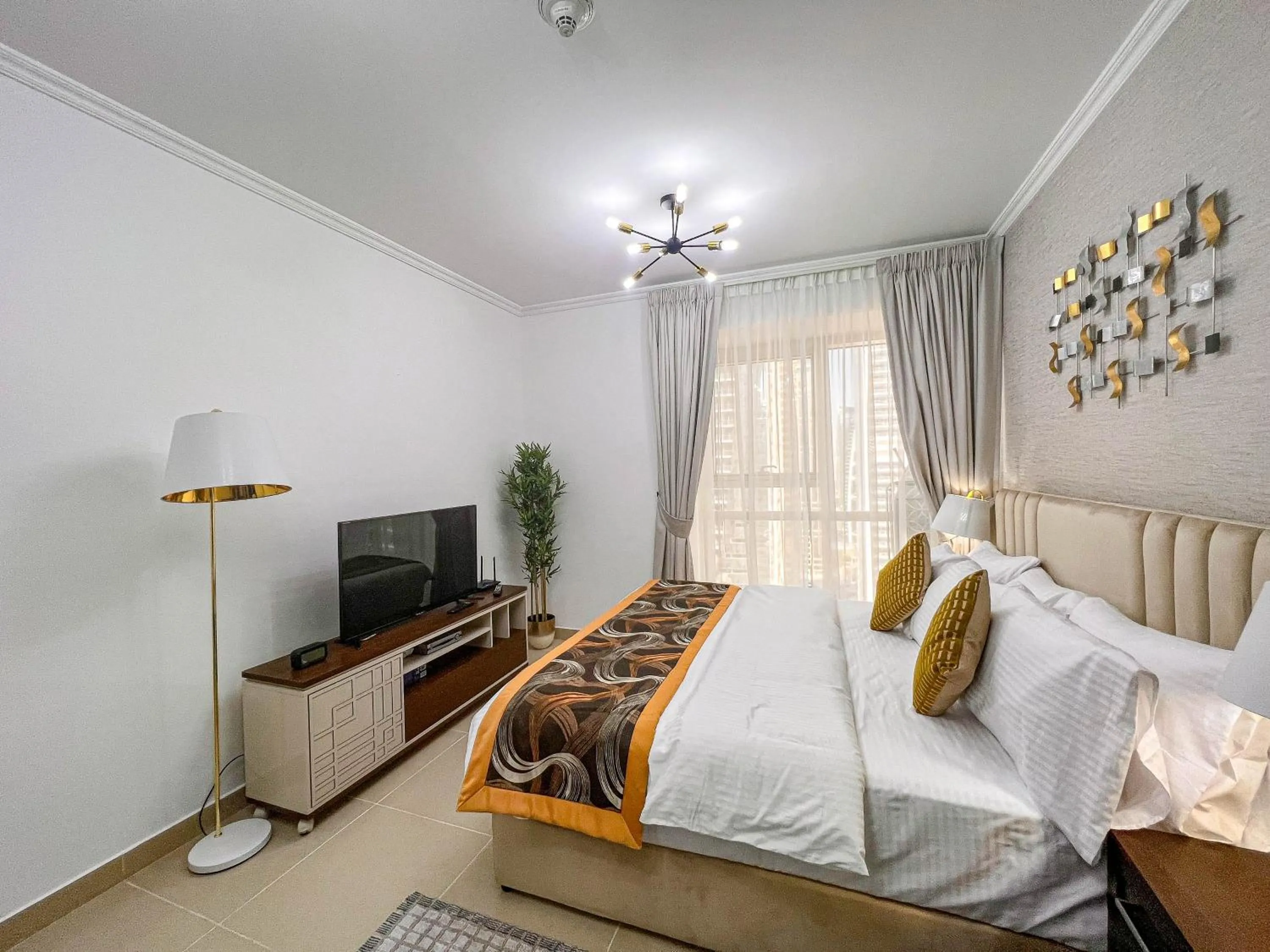 Bed in Cosmos Living Luxurious Studio Near Metro