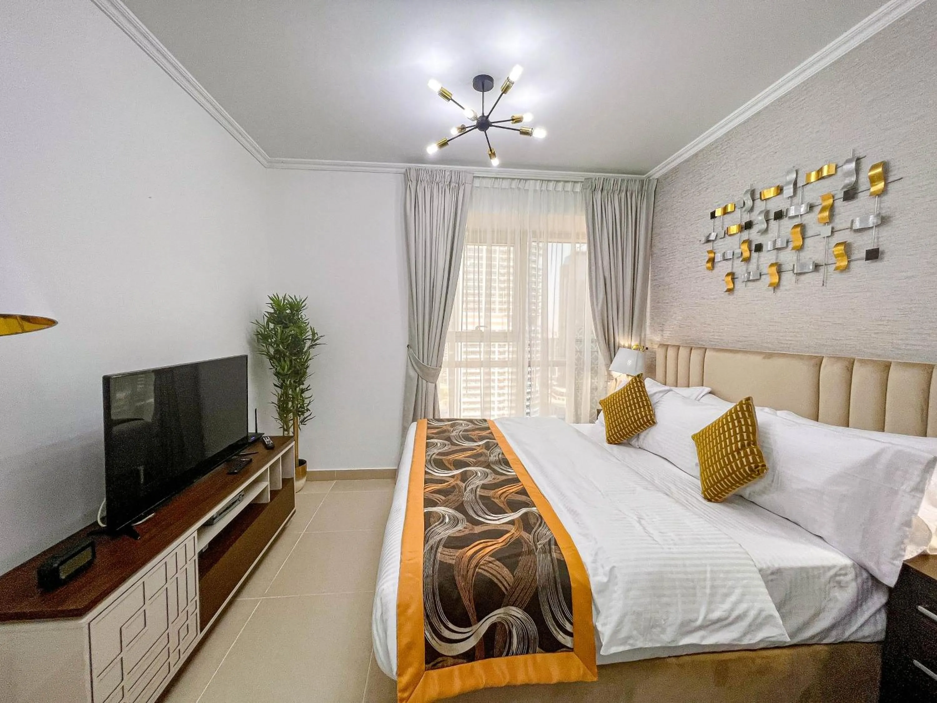 Bed in Cosmos Living Luxurious Studio Near Metro