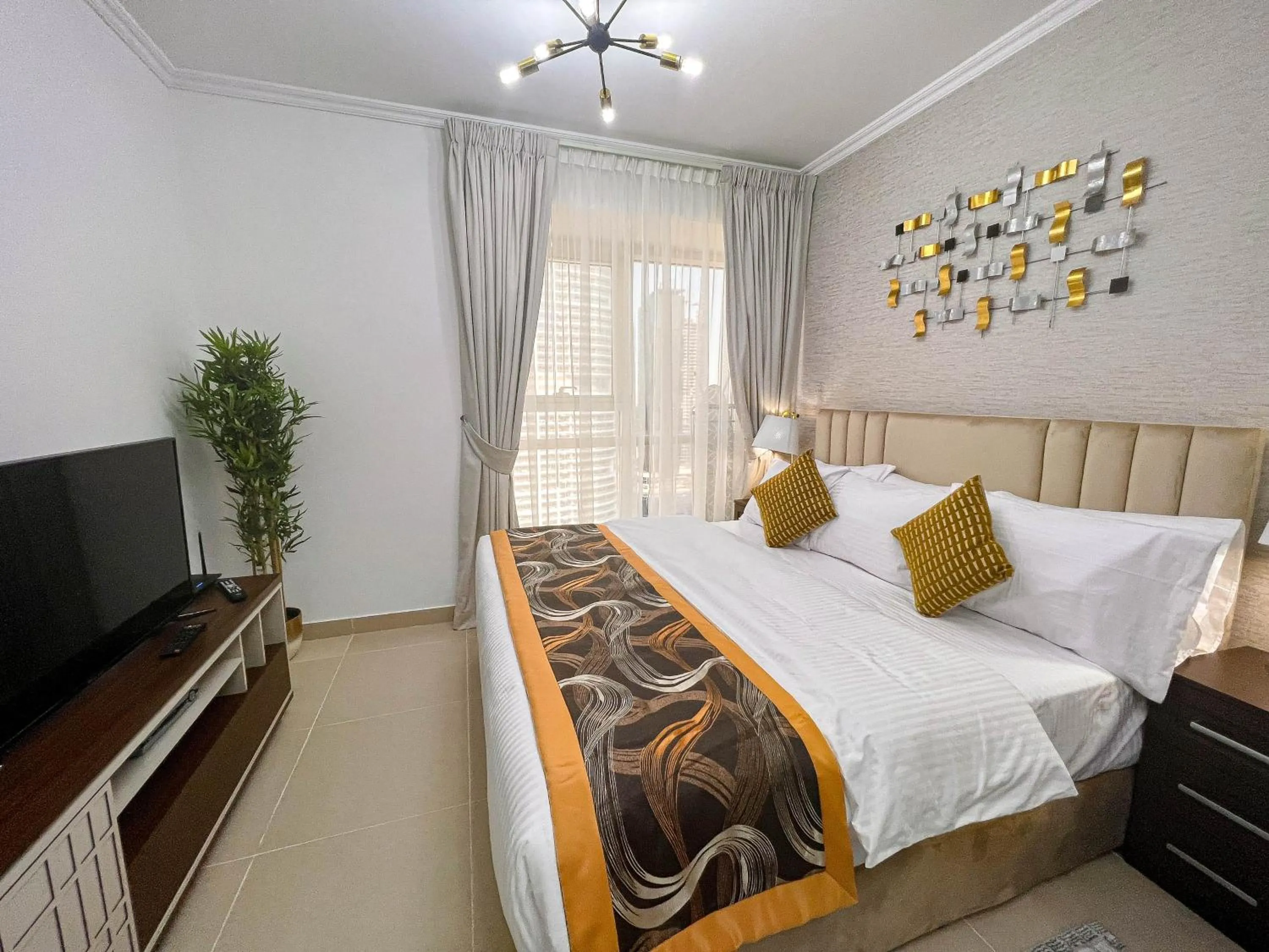 Bed in Cosmos Living Luxurious Studio Near Metro