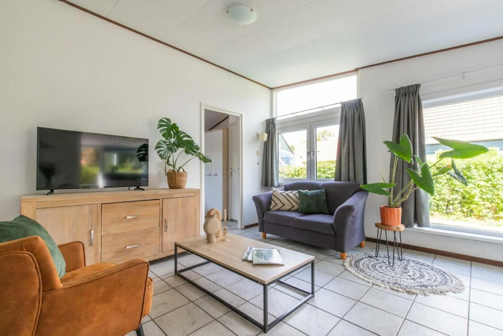 Communal lounge/ TV room in Camping de Brem
