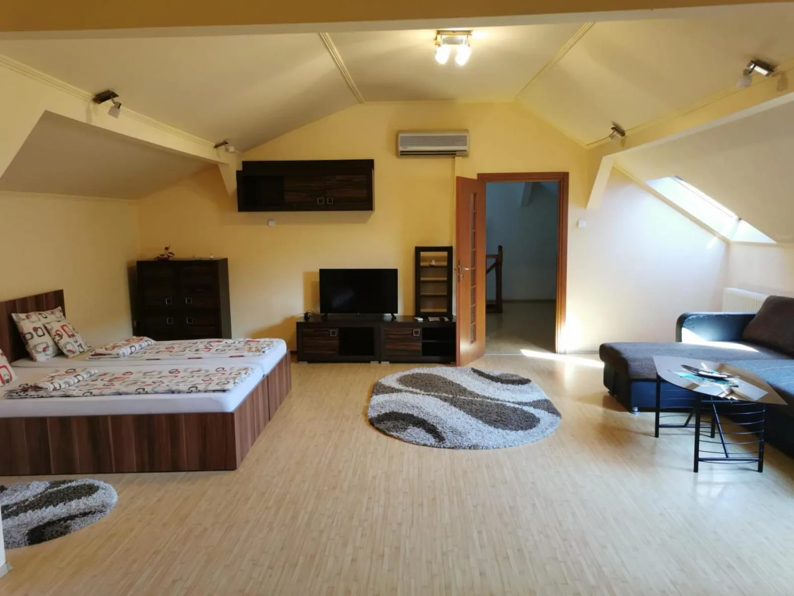 Living room, Bed in Premier Apartment