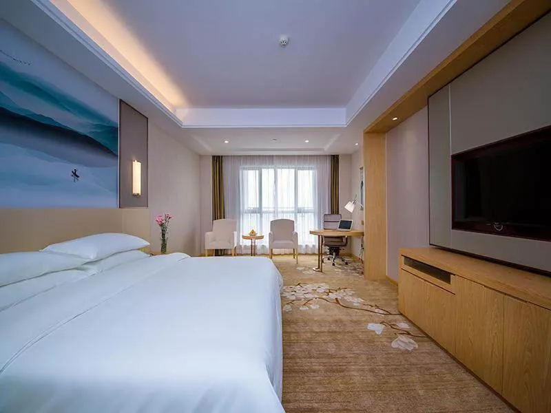 Bed in Vienna International Hotel Yichang Gezhouba Sanxia Culture Tiandi