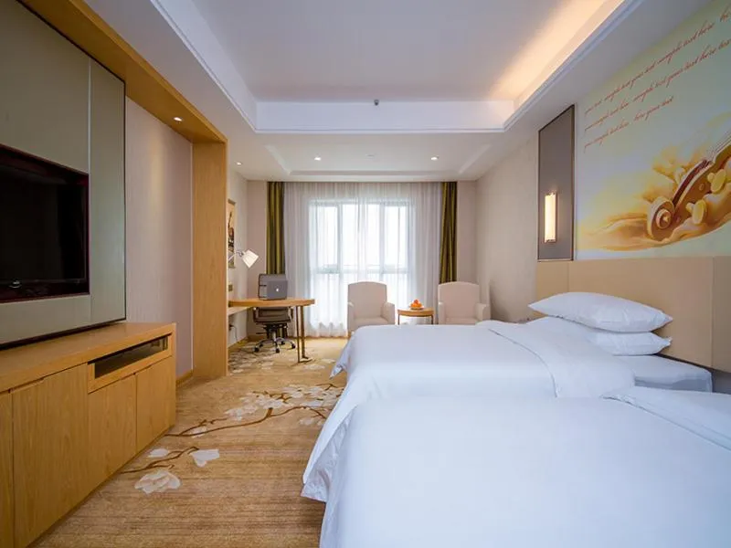 Bed in Vienna International Hotel Yichang Gezhouba Sanxia Culture Tiandi