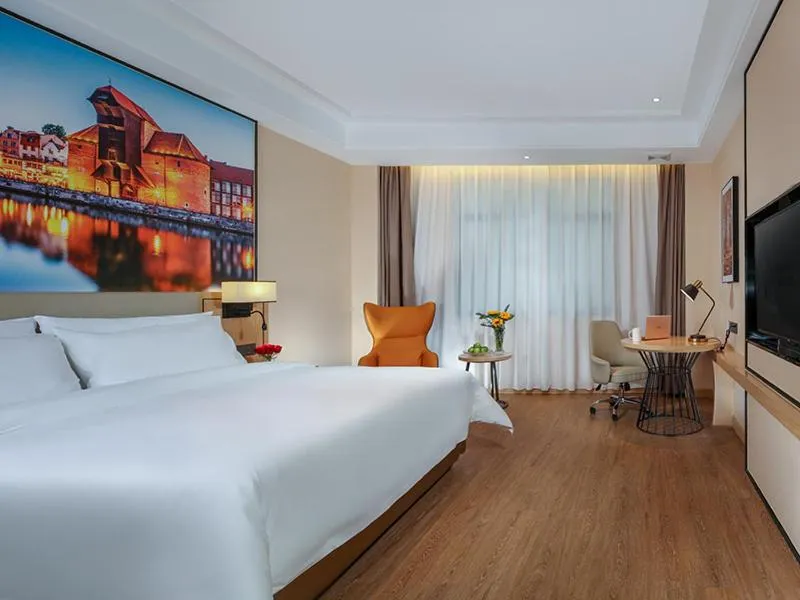 Bed in Vienna International Hotel Chongqing North Station