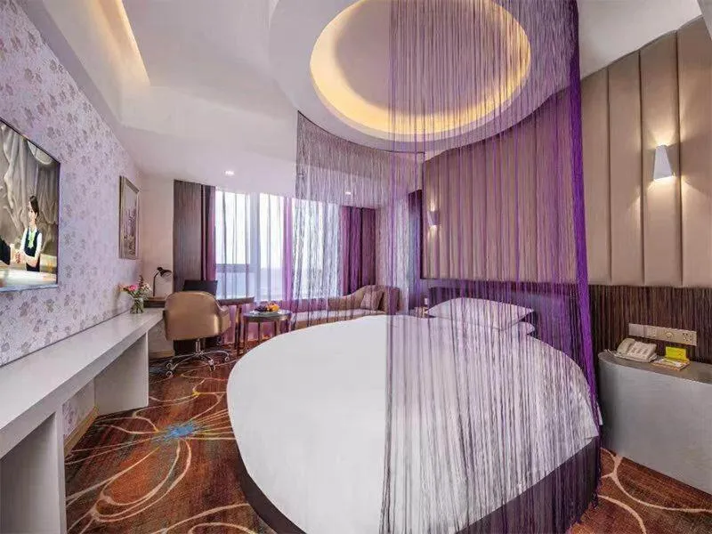 Bed in Vienna International Hotel Chongqing Yuanyangyuanboyuan