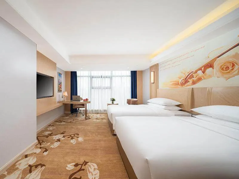 Bed in Vienna International Hotel Chongqing Yuanyangyuanboyuan