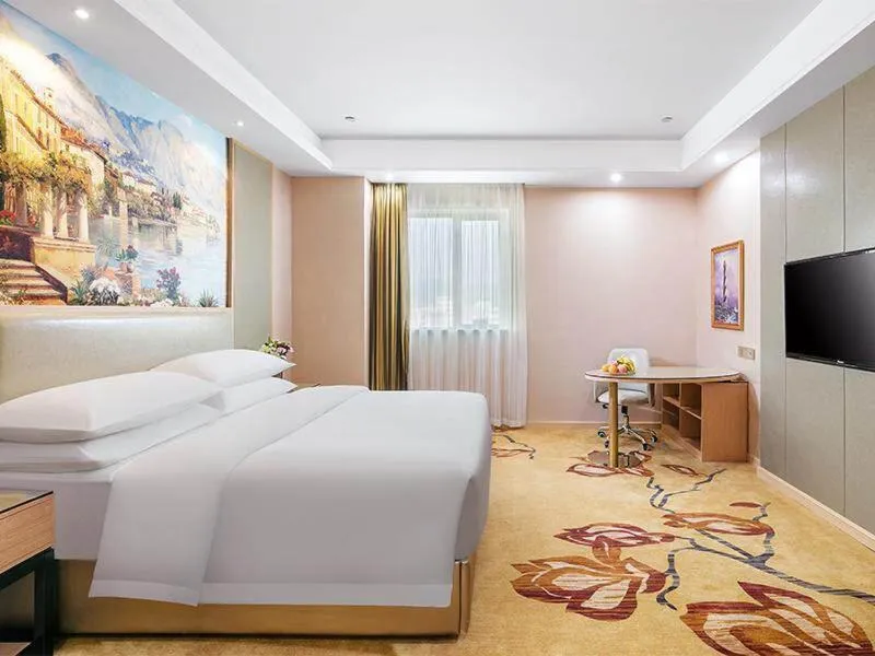 Bed in Vienna International Hotel Zhejiang Wenzhou Ruian Tangxia