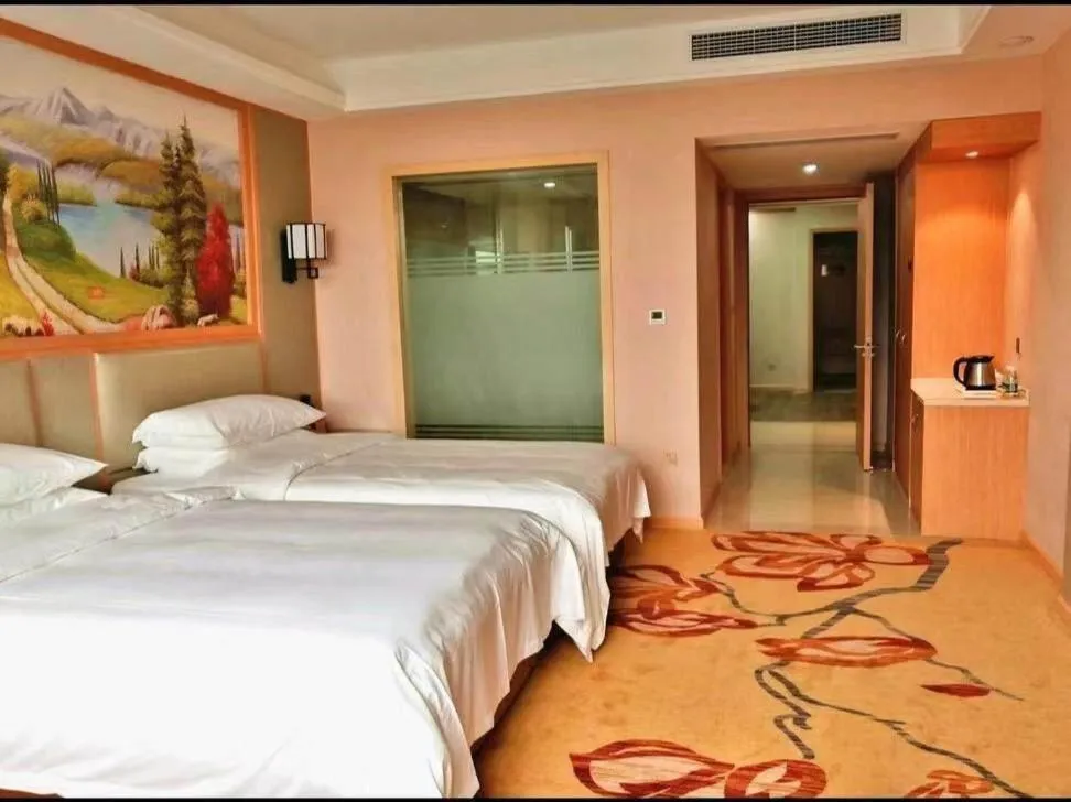 Bed in Vienna International Hotel Zhejiang Wenzhou Ruian Tangxia