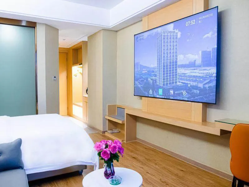 Bed in Vienna International Hotel Jiangsu Wuxi Jiangyin Sports Center