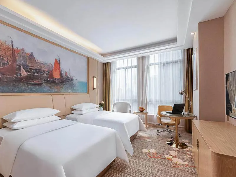 Bed in Vienna Hotel Danyang Glasses City High Speed Railway Station Dabo