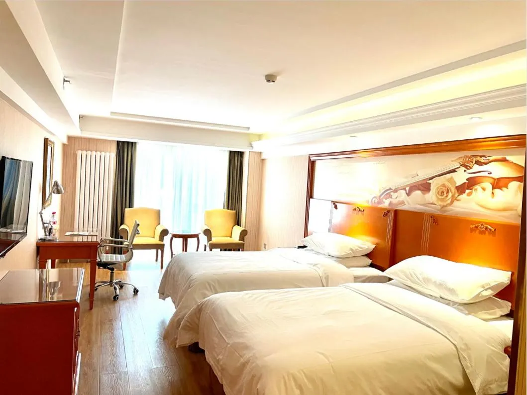 Bed in Vienna Hotel Harbin West Railway Station Wanda Plaza