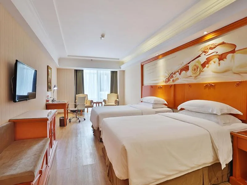 Bed in Vienna Hotel Harbin West Railway Station Wanda Plaza